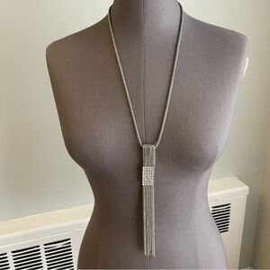 Long silver necklace with rectangular tassel pendant